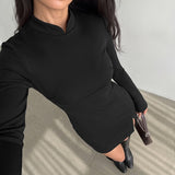 Long sleeved slit short skirt